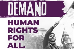 Man waving a flag with the text Demand Human Rights for All